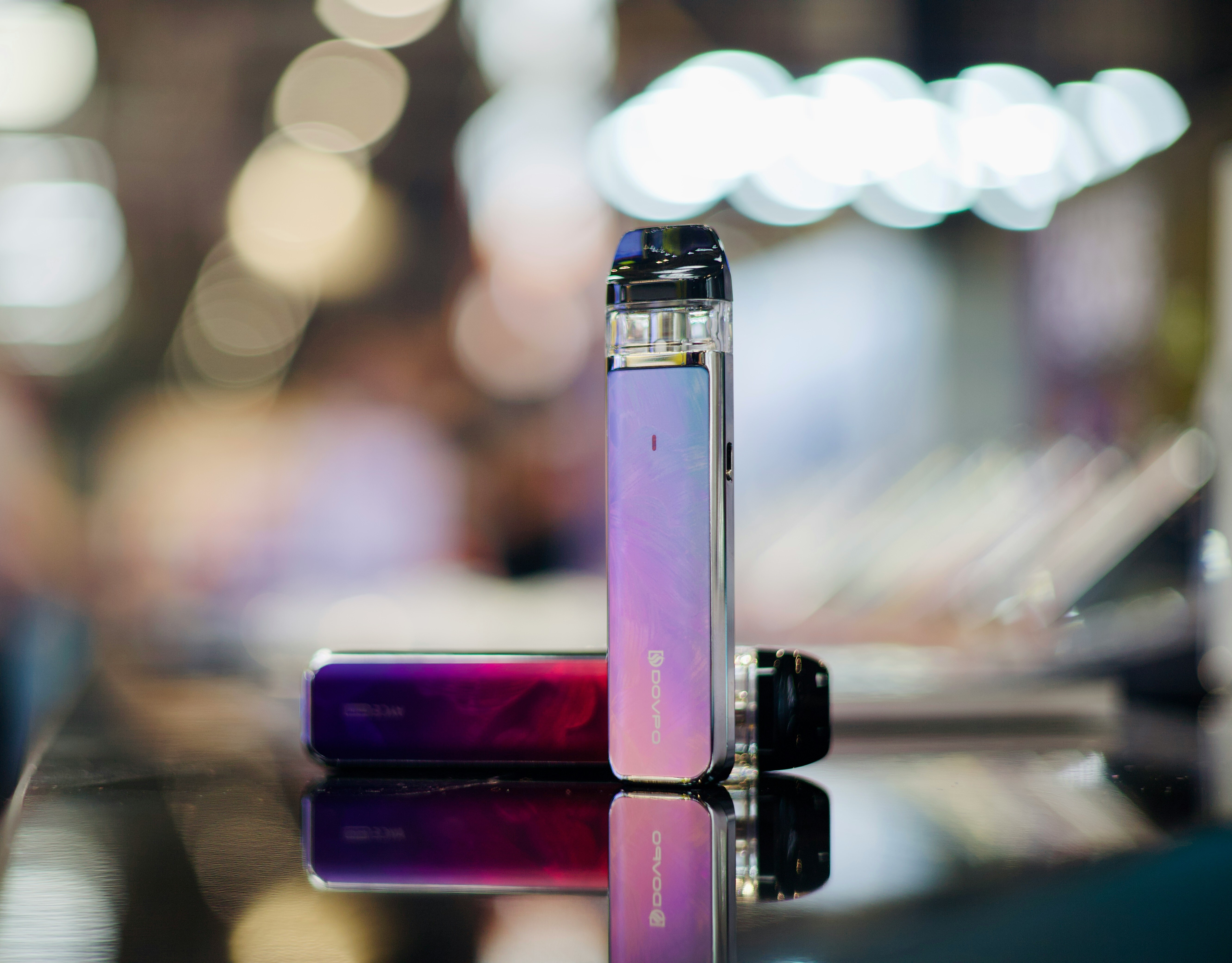 closeup of two vape devices on table